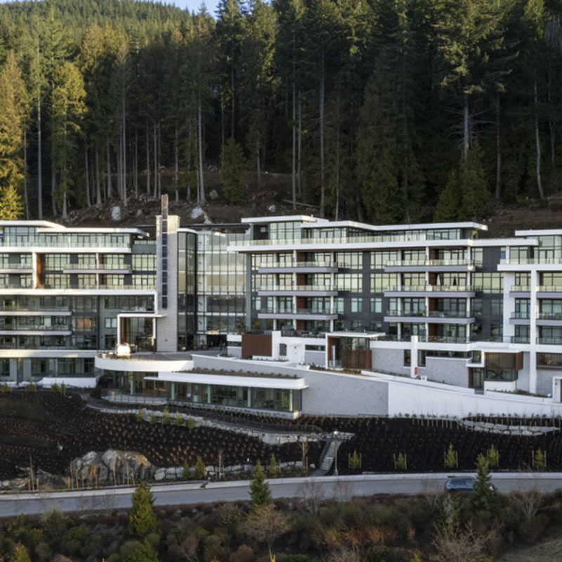 multi-story commercial building with full windows and balconies